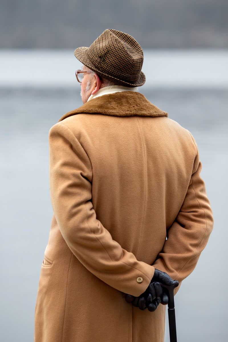 An elderly gentleman gazing over the water — a story worth preserving
